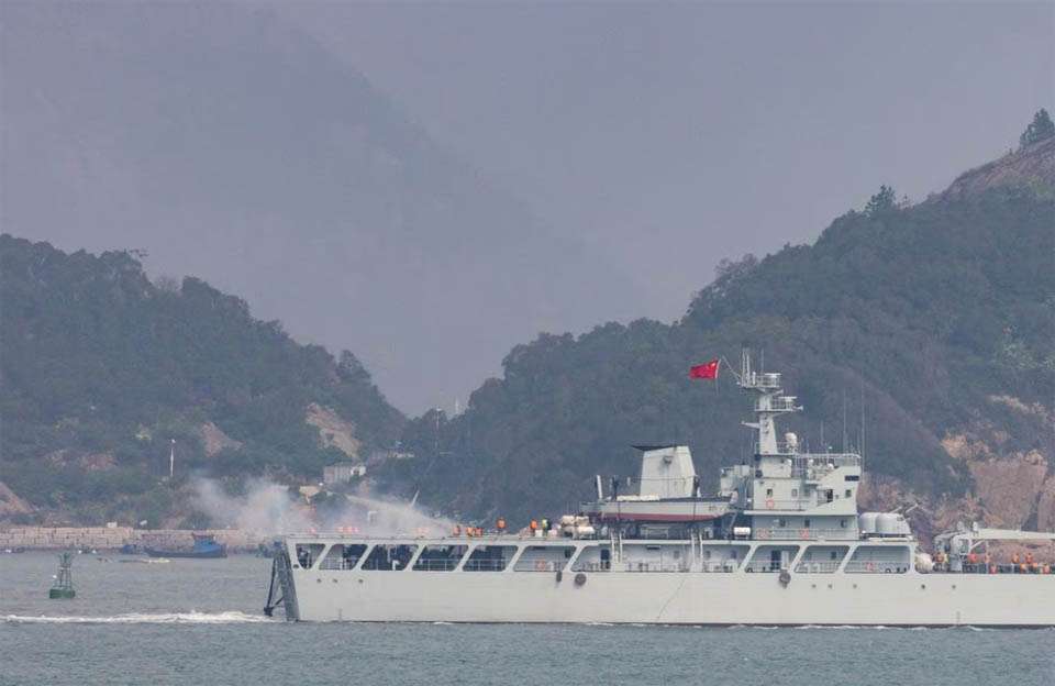 Chinese warship fires towards the shore during a military drill near Fuzhou near the Taiwan controlled Matsu Islands that are close to the Chinese coast, China,